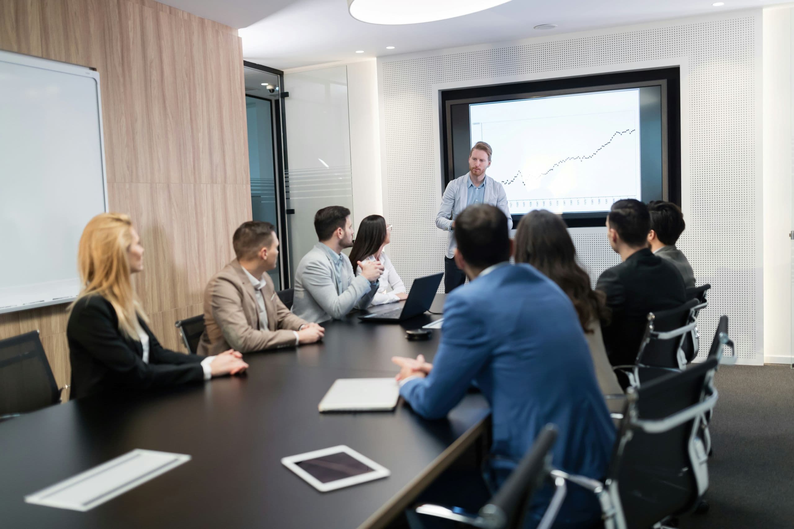 A group of people sitting around a conference table