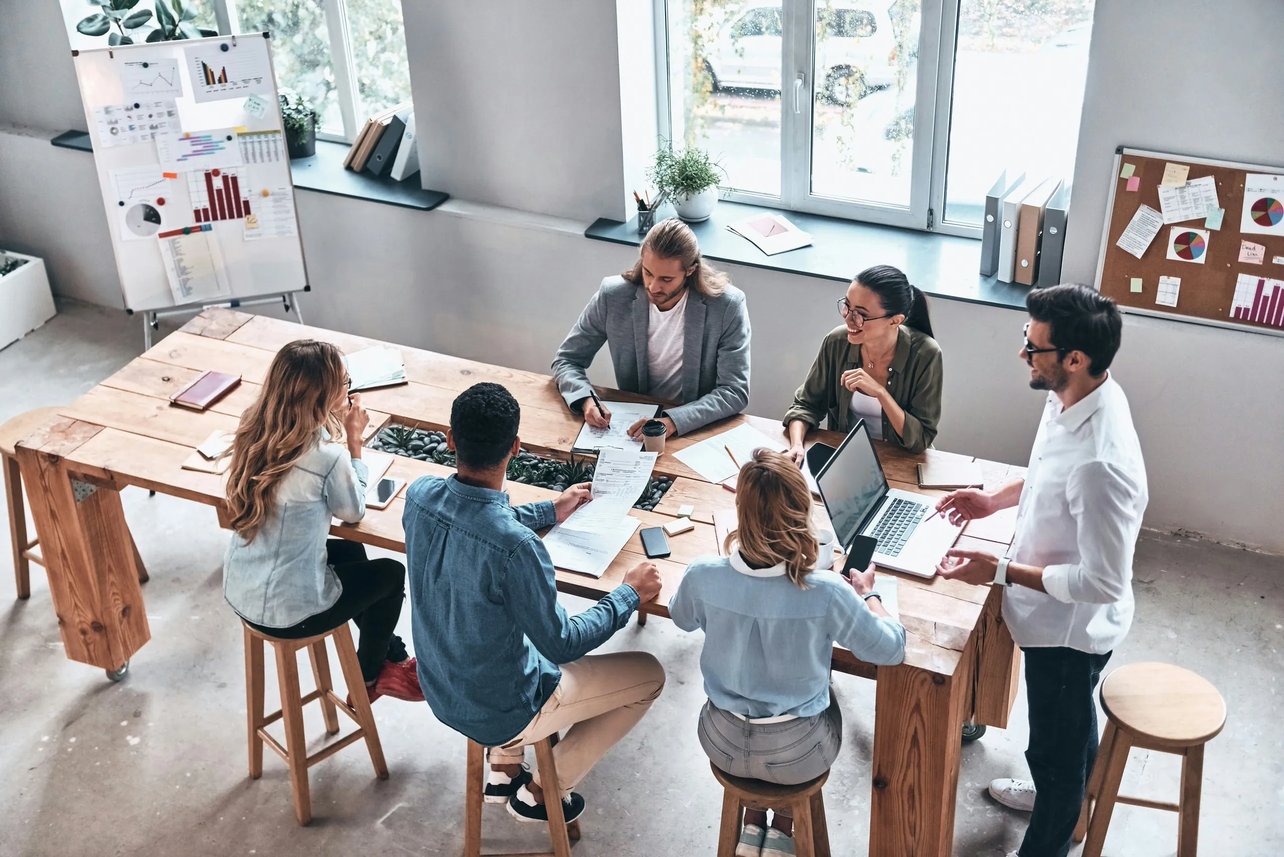 A group of people working together around a table