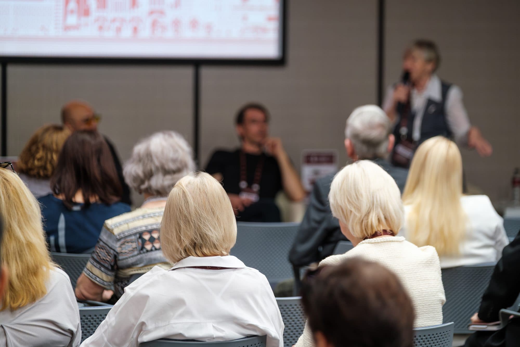 Members listening to a speaker at a meeting